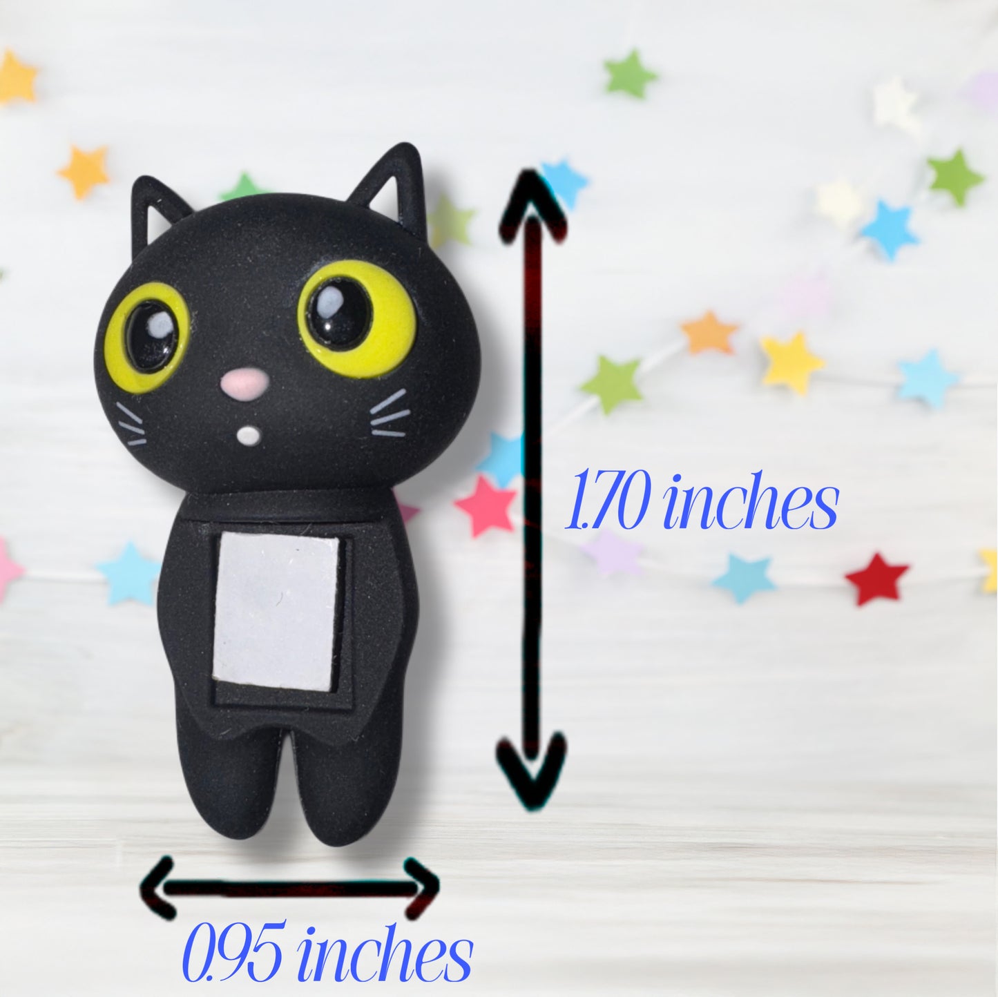 Black cat-shaped toy with measurements on a white background with colorful stars. measurements are 1.70 inches on height and .95 inches wide